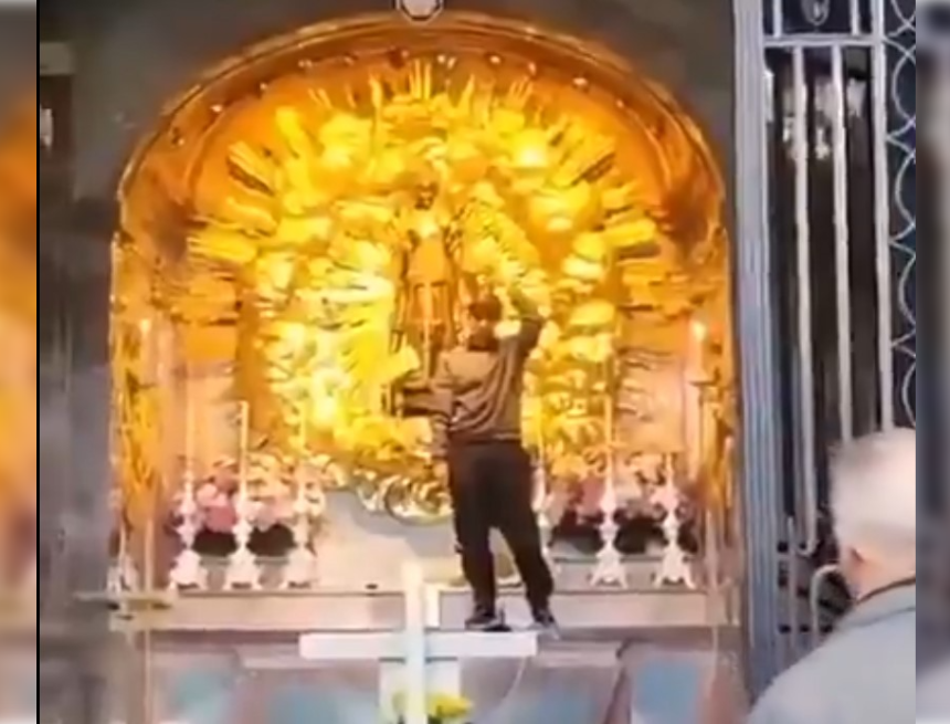 Afghan Asylum Seeker Climbs Alter – Rips Off the Gowns of the Famous Black Madonna of Switzerland and Puts On Her Crown – VIDEO | The Gateway Pundit